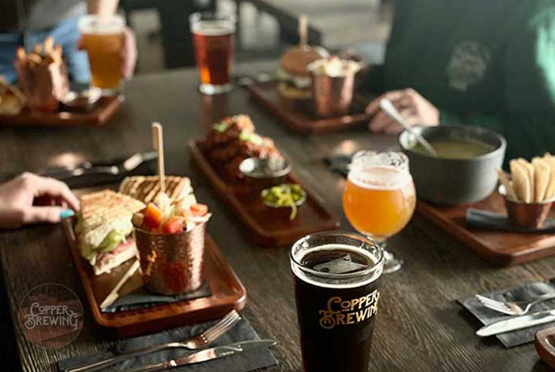 image of table with food and drinks at Copper Brewing